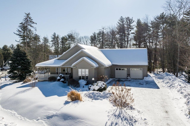 view of front of property with covered porch and a garage