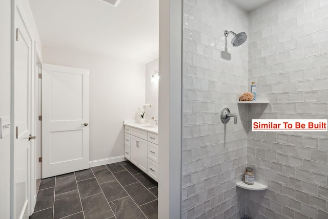 bathroom featuring tile patterned floors, vanity, and a shower