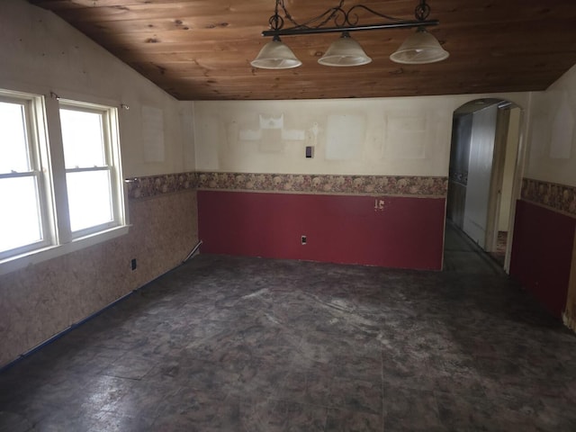 spare room featuring lofted ceiling and wood ceiling