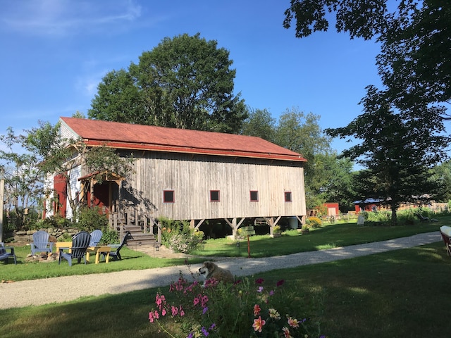 view of property exterior featuring a yard