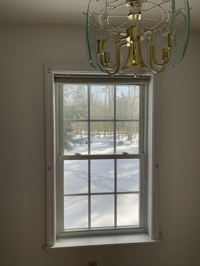 interior details featuring a notable chandelier