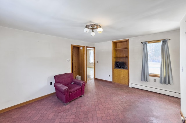 living area with baseboard heating