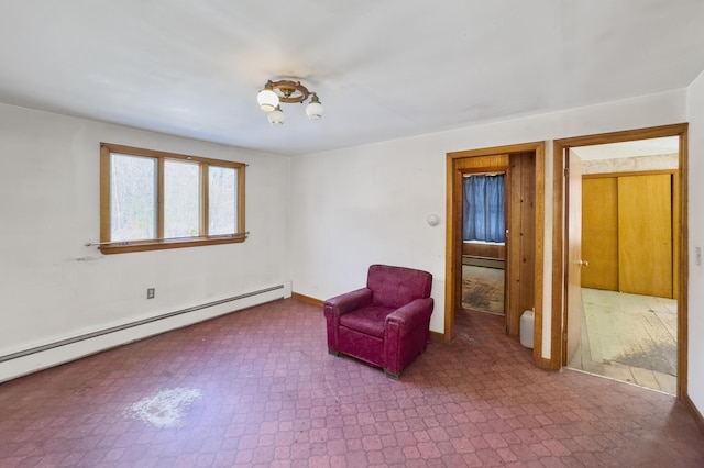 unfurnished room featuring a baseboard heating unit