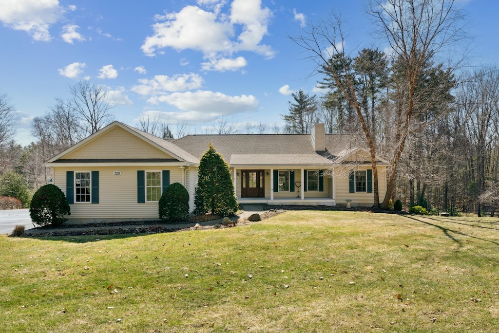 328 Brixham Rd, Eliot, ME 03903 - ranch-style home featuring a porch, a front yard, and a chimney
