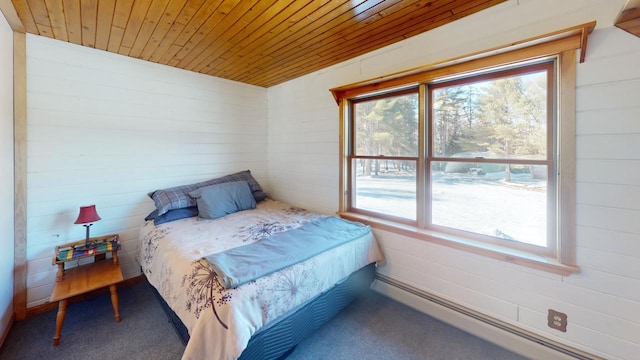 bedroom featuring wooden ceiling and carpet