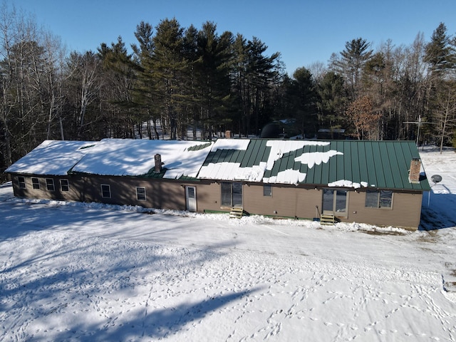 view of snow covered house