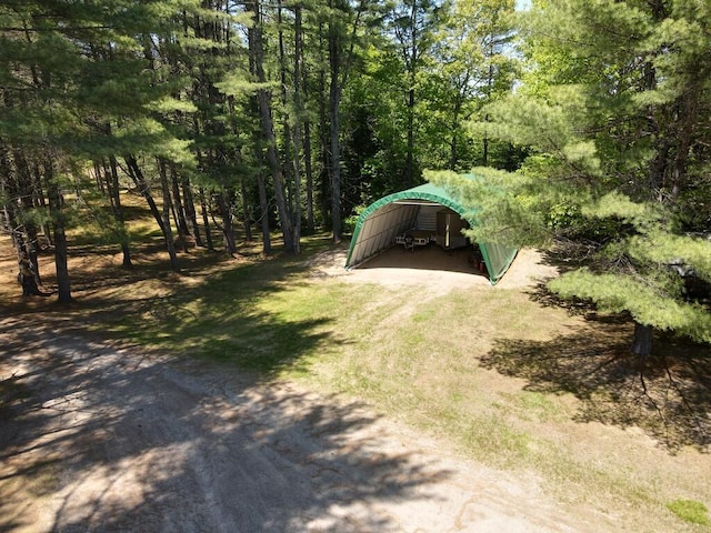 1449 Main Rd, Greenbush, ME 04418 - view of yard featuring a forest view and driveway
