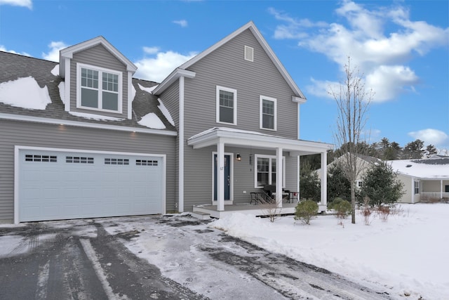 front facade with a garage and a porch