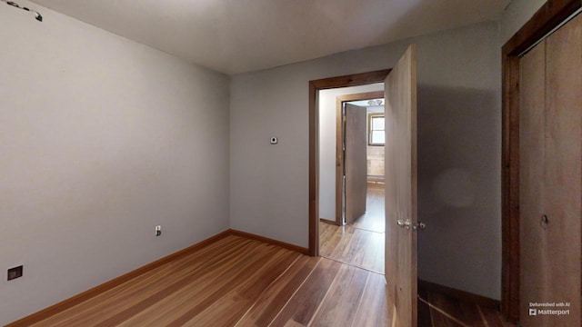 spare room featuring light hardwood / wood-style flooring