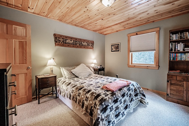 carpeted bedroom featuring wood ceiling