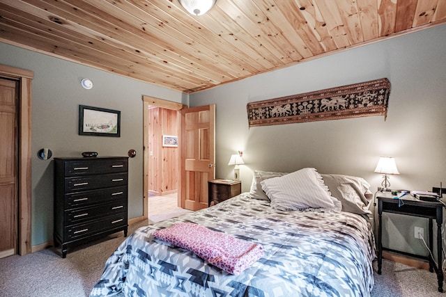 bedroom with light colored carpet, ornamental molding, and wooden ceiling