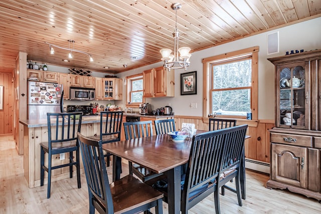 dining area featuring a baseboard heating unit, wooden walls, light hardwood / wood-style floors, and wooden ceiling