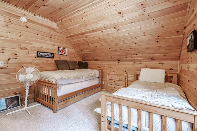 carpeted bedroom featuring wooden ceiling and wooden walls