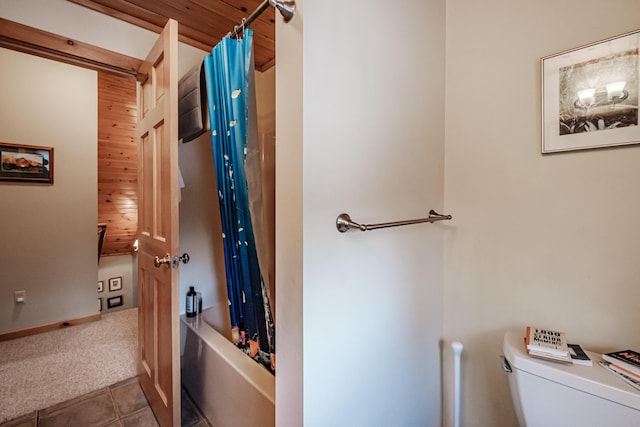 bathroom featuring toilet, shower / bathtub combination with curtain, and wooden ceiling