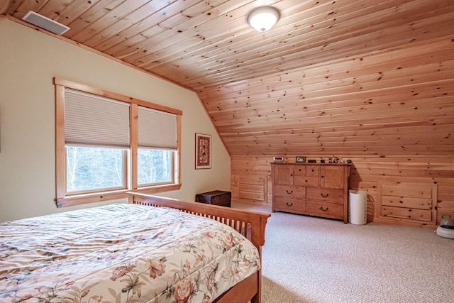 carpeted bedroom with wood ceiling and vaulted ceiling