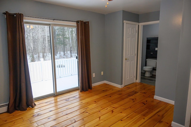 empty room featuring ceiling fan and light hardwood / wood-style floors