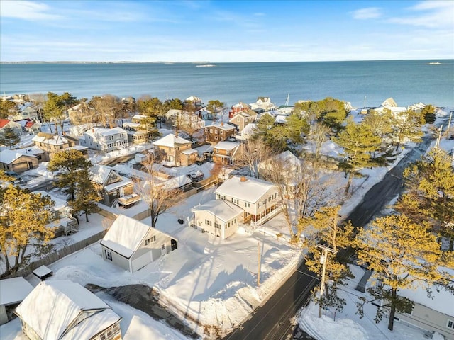 drone / aerial view featuring a water view and a residential view