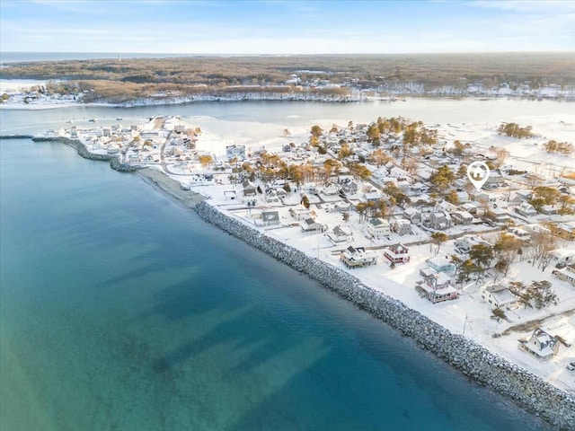 birds eye view of property featuring a water view and a beach view