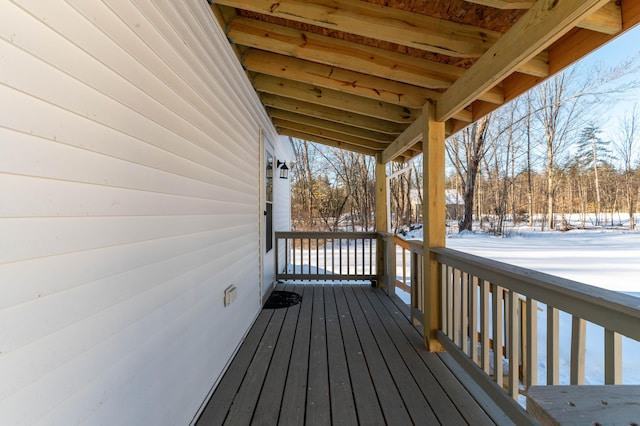 view of snow covered deck