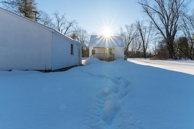 view of yard layered in snow