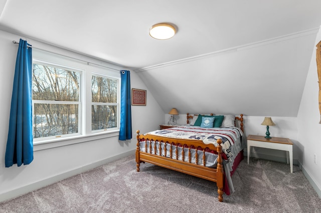 carpeted bedroom featuring lofted ceiling