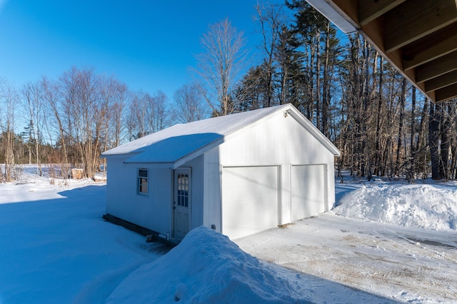 view of snow covered garage