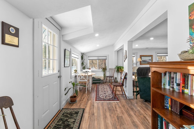 foyer with lofted ceiling and wood-type flooring