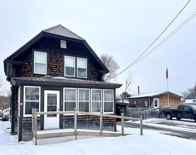 view of snow covered house