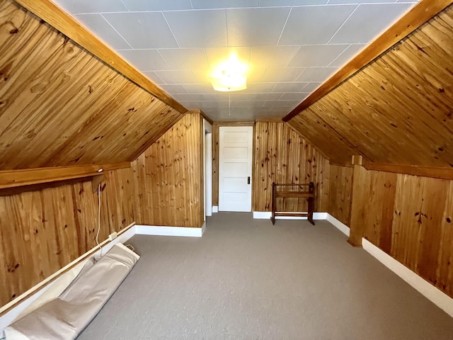 bonus room with carpet floors and vaulted ceiling