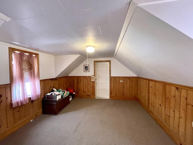 bonus room featuring light colored carpet and lofted ceiling