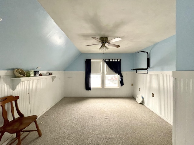 bonus room with lofted ceiling, light colored carpet, and ceiling fan