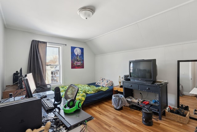 bedroom with hardwood / wood-style flooring and vaulted ceiling