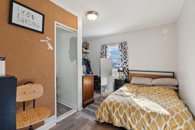 bedroom featuring dark hardwood / wood-style floors