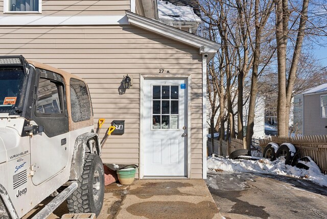 view of snow covered property entrance