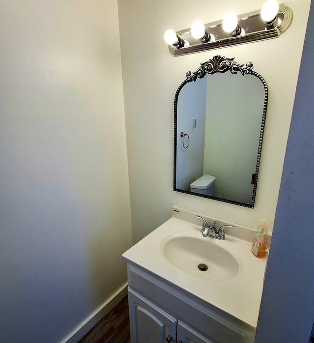 bathroom with vanity and hardwood / wood-style floors