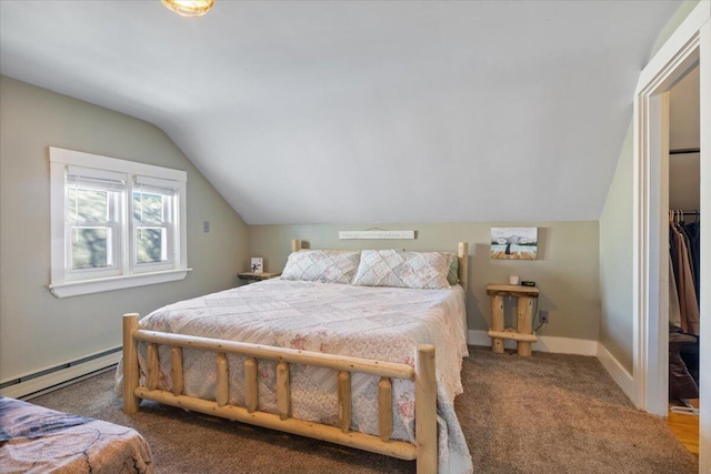 carpeted bedroom with a baseboard heating unit, vaulted ceiling, and baseboards