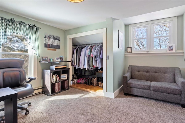 office area with light colored carpet and baseboards