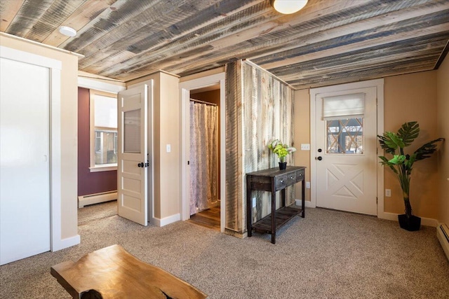 entrance foyer with a baseboard radiator, baseboards, baseboard heating, and light colored carpet