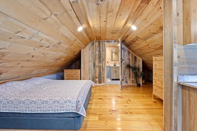 bedroom featuring lofted ceiling, wood ceiling, and wood finished floors