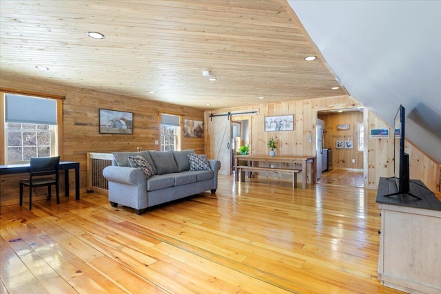 living area featuring light wood-type flooring, wood ceiling, recessed lighting, and a barn door