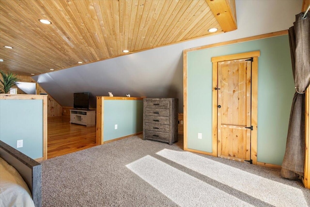 unfurnished bedroom with wooden ceiling, vaulted ceiling, carpet flooring, and recessed lighting