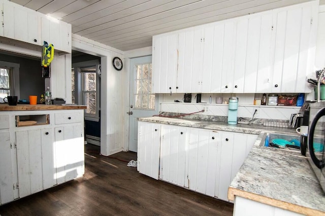 kitchen with white cabinetry and dark wood-type flooring