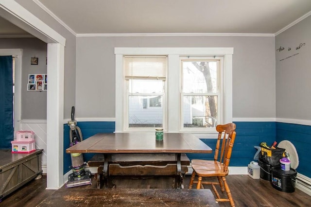 dining space featuring ornamental molding, hardwood / wood-style floors, and breakfast area