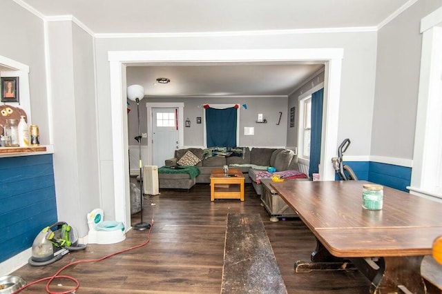 dining area with dark hardwood / wood-style flooring and ornamental molding