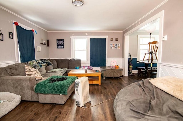 living room with ornamental molding and dark wood-type flooring