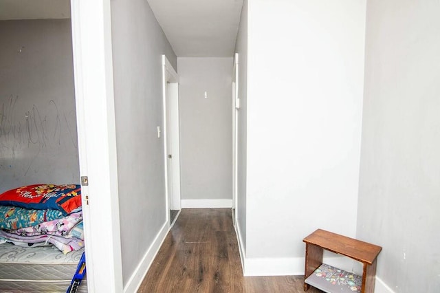 hall with dark hardwood / wood-style flooring