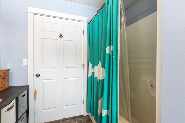 bathroom with a shower with shower curtain