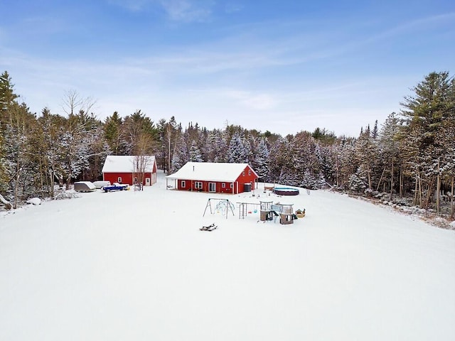 snowy yard with an outdoor structure