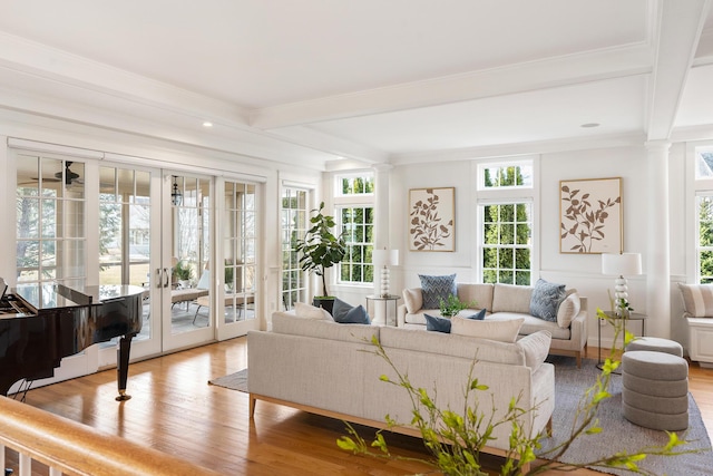 living area with french doors, wood finished floors, and beamed ceiling