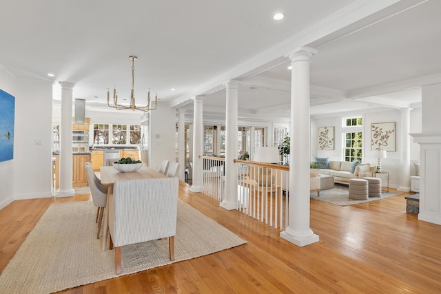dining room featuring baseboards, recessed lighting, ornamental molding, and light wood-type flooring